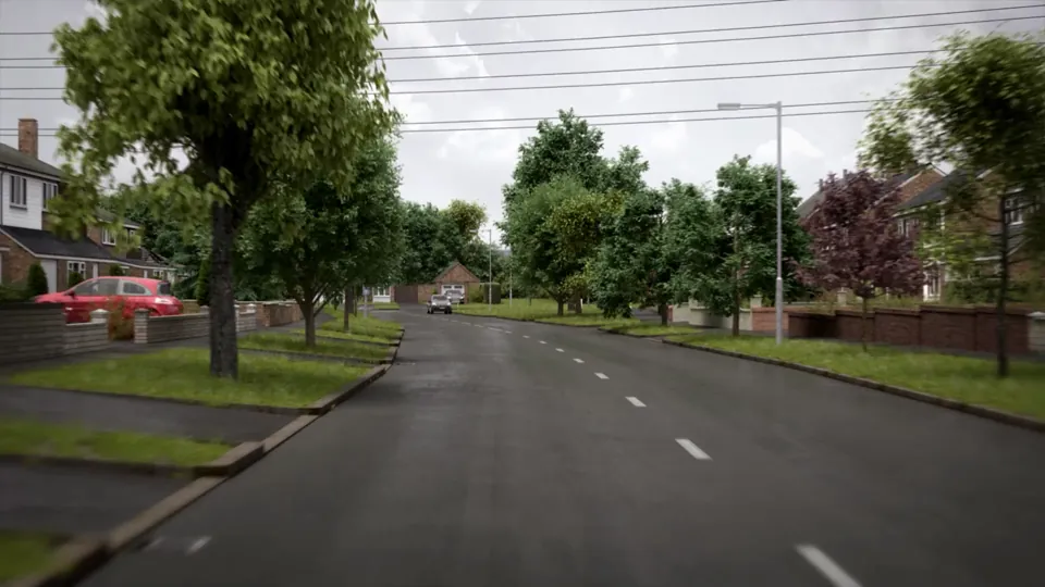 A wide suburban avenue with a tree-planted central reservation, semi-detached houses and a pedestrian refuge island on a wet day.