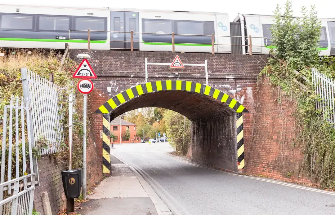 Illustration for the question: Which type of vehicle should you be ready to give way to as you approach this bridge?