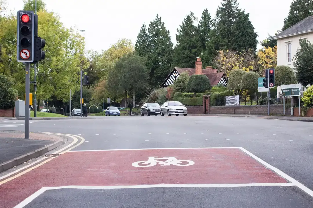 Illustration for the question: This junction, controlled by traffic lights, has a marked area between two stop lines. What's this for?