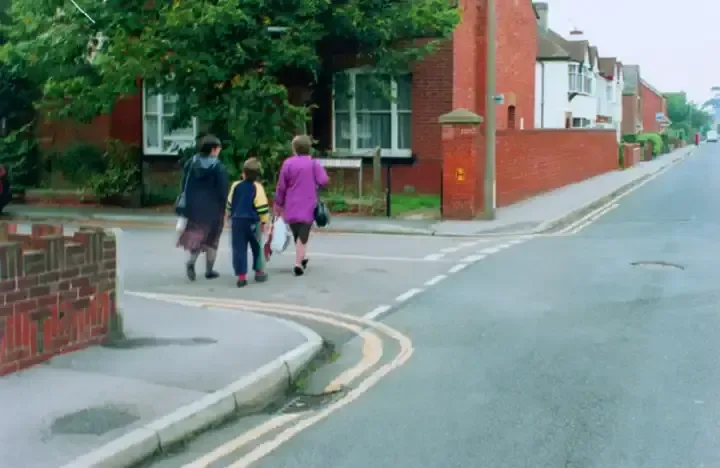 Illustration for the question: What should you do if you want to turn left at a junction where pedestrians have started to cross?